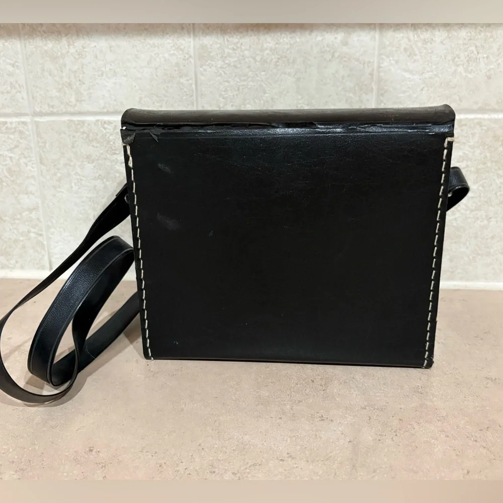 Vintage Polaroid Swinger camera and case